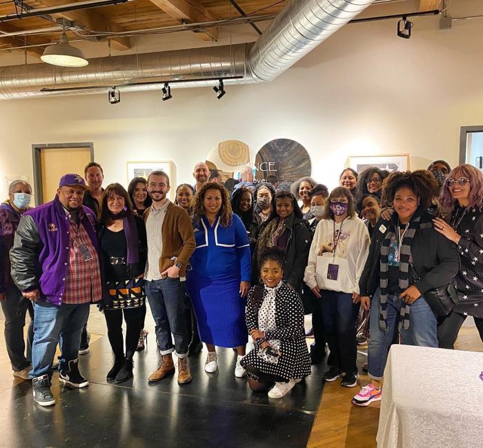 Prince 365 Clubhouse community group photo in an art gallery on a Minneapolis trip