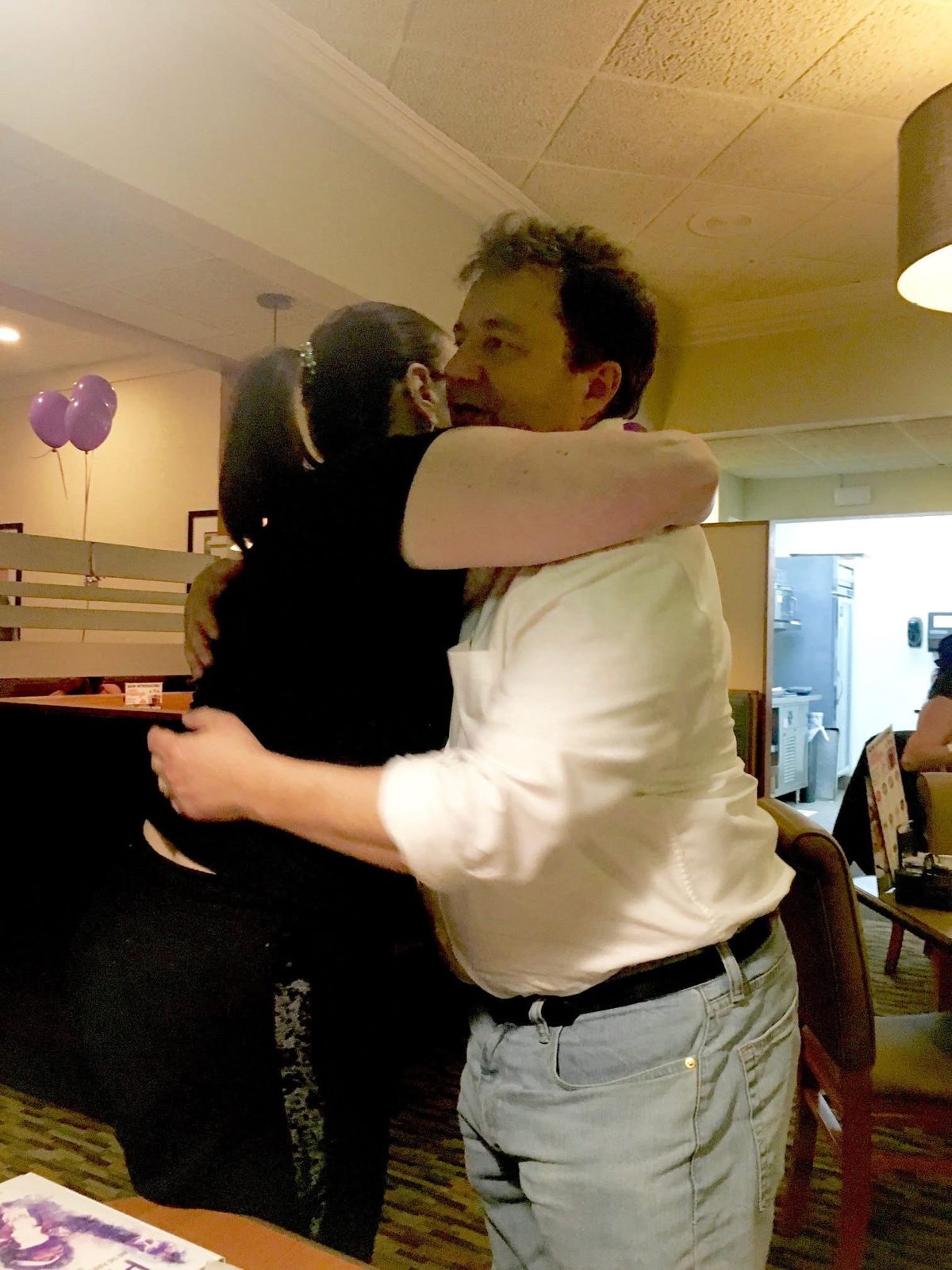 A hug at the book signing
